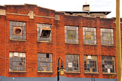 Sunlight hits a painted brick building in Knoxville, Tennessee